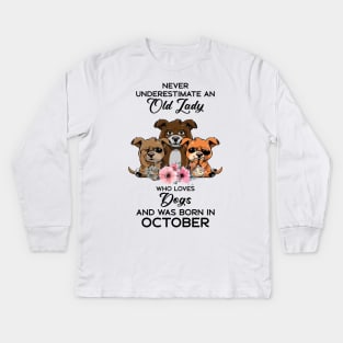 Never Underestimate An Old Woman Who Loves Dogs And Was Born In October Kids Long Sleeve T-Shirt